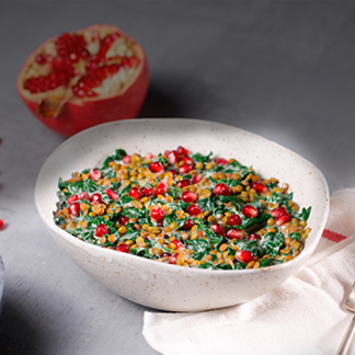 linzen met spinazie en granaatappel